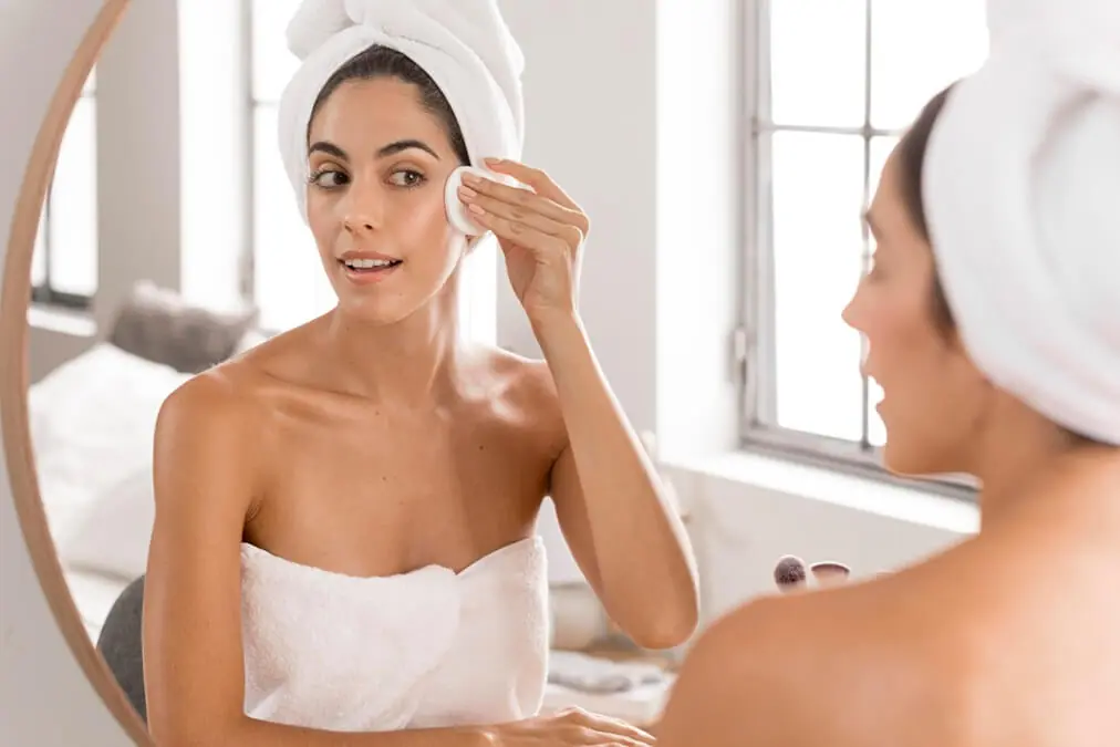 beautiful young woman using spa products home 1