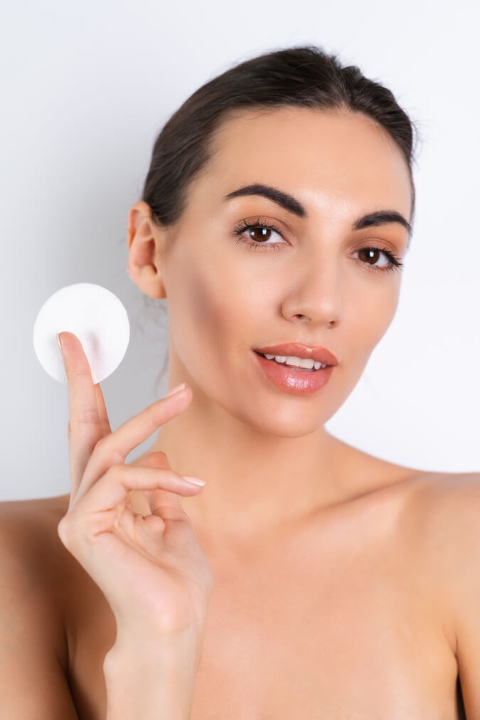 close beauty portrait topless woman with perfect skin natural makeup removing cotton pads white backgroundx9 1